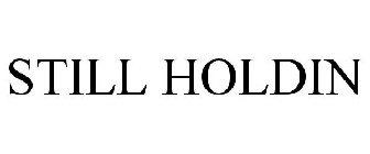 STILL HOLDIN