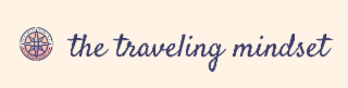 THE TRAVELING MINDSET NEXT TO A COMPASS